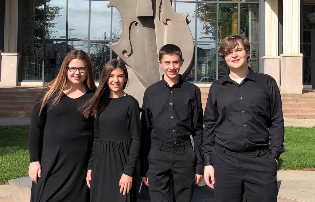 Four MCMS chorus members perform at GMEA